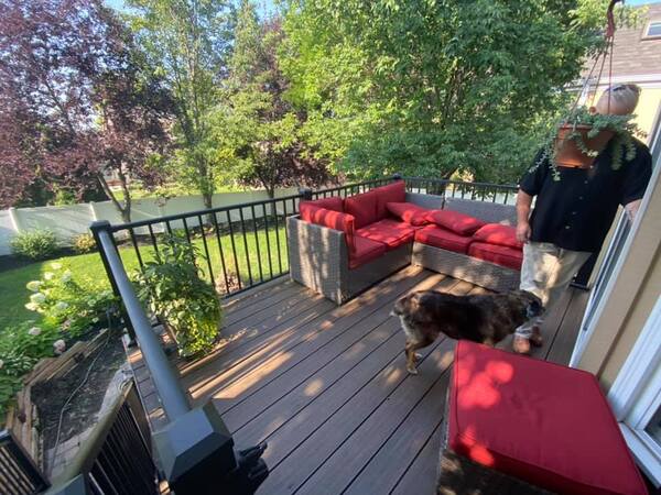 A composite decking with a red couch