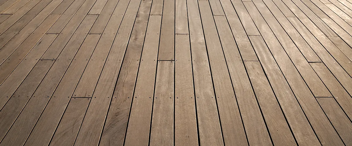 A close up with a brown wooden deck