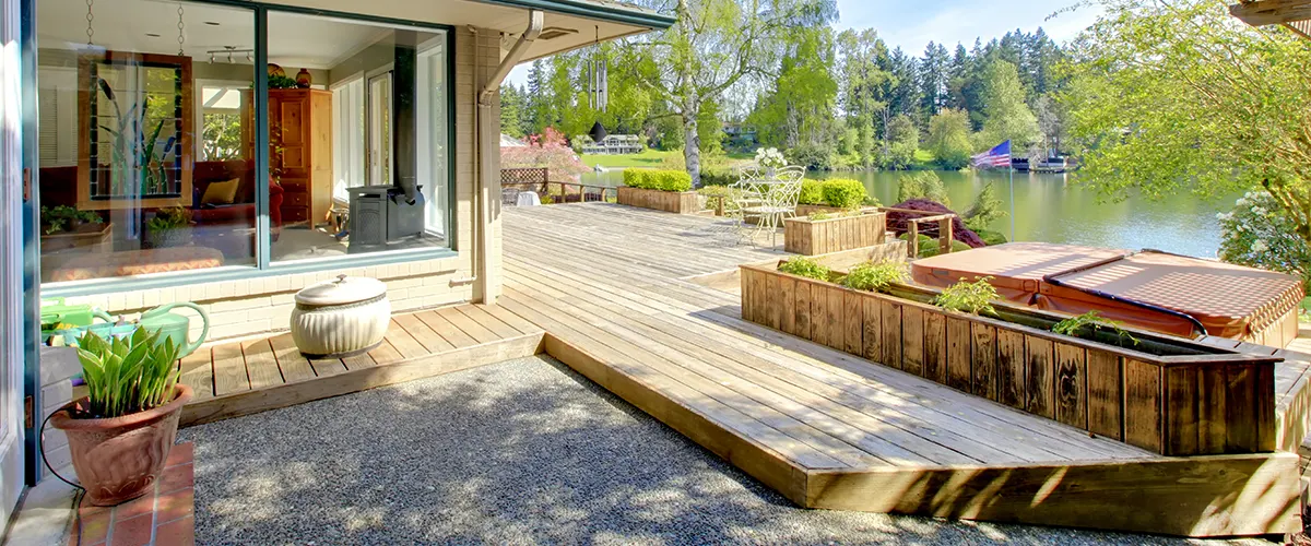 Complex decking near lake and house