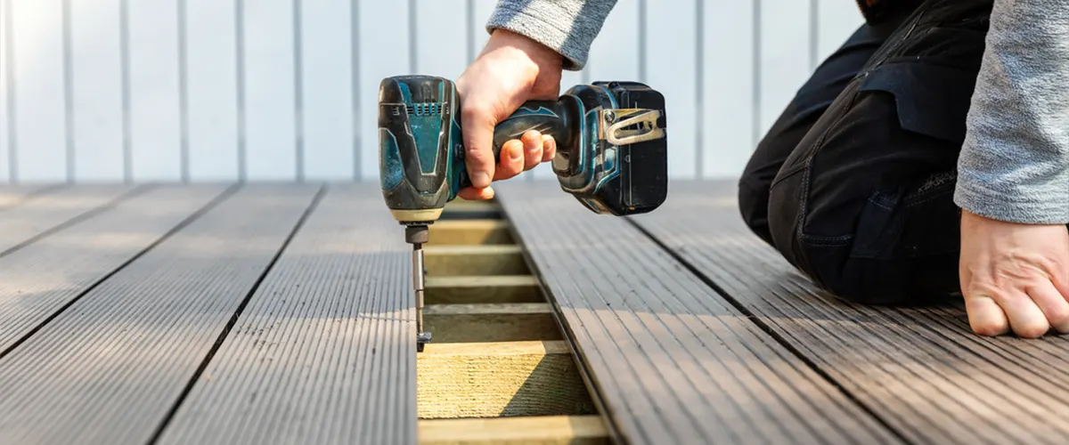 Men installing deck boards