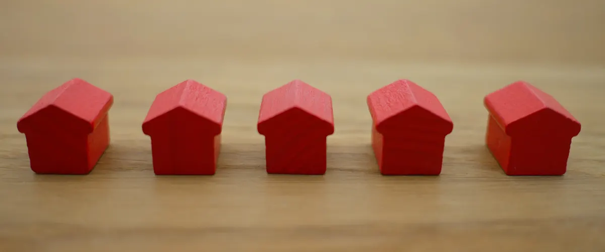 Five red houses in miniature
