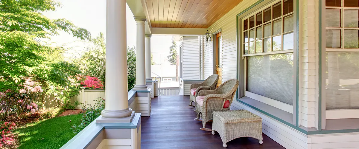A front porch with decorative posts