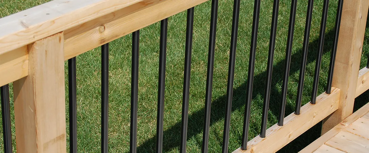 A metal rail with a wood balustrade