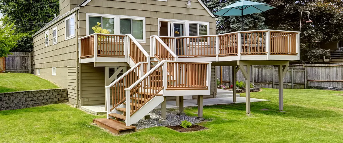 An elevated deck with two sets of stairs and deck footings