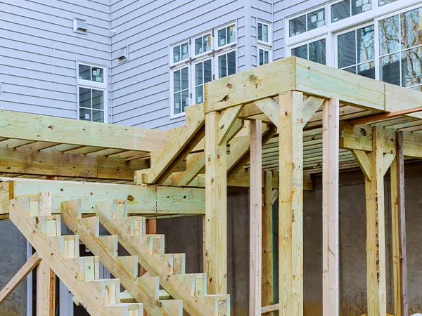 A wooden deck frame for an elevated deck