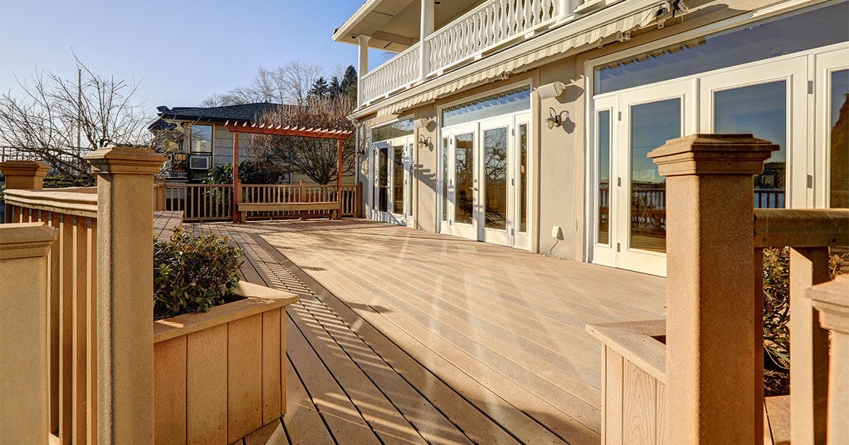 A composite decking with composite rail