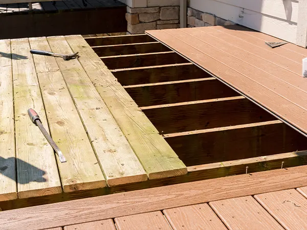 A wood deck being replaced with composite decking