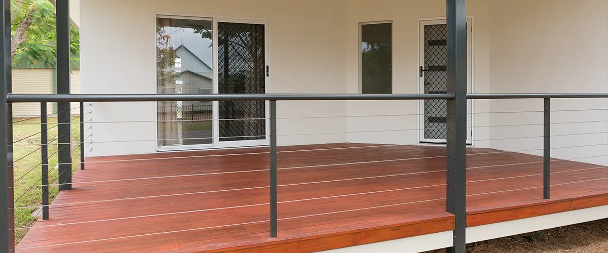 A metal rail on a wood deck