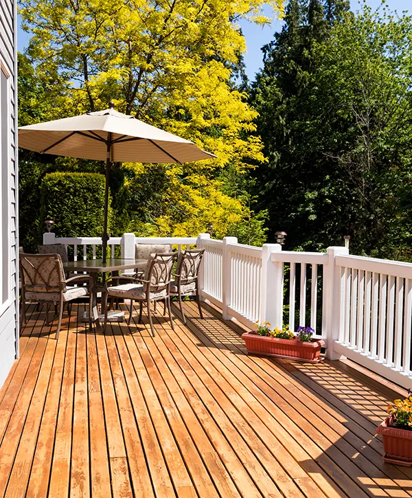A 12x24 deck addition with white railings and cedar decking
