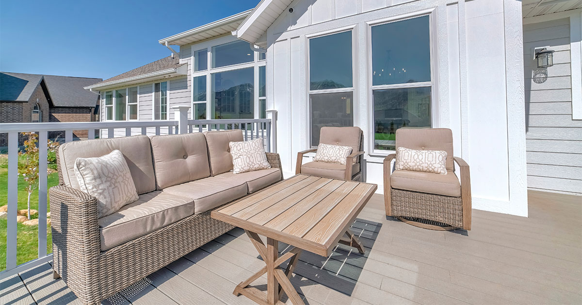 Blog A beige vinyl deck material with a couch, chairs, and a table