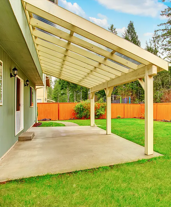 A concrete patio with a large awning