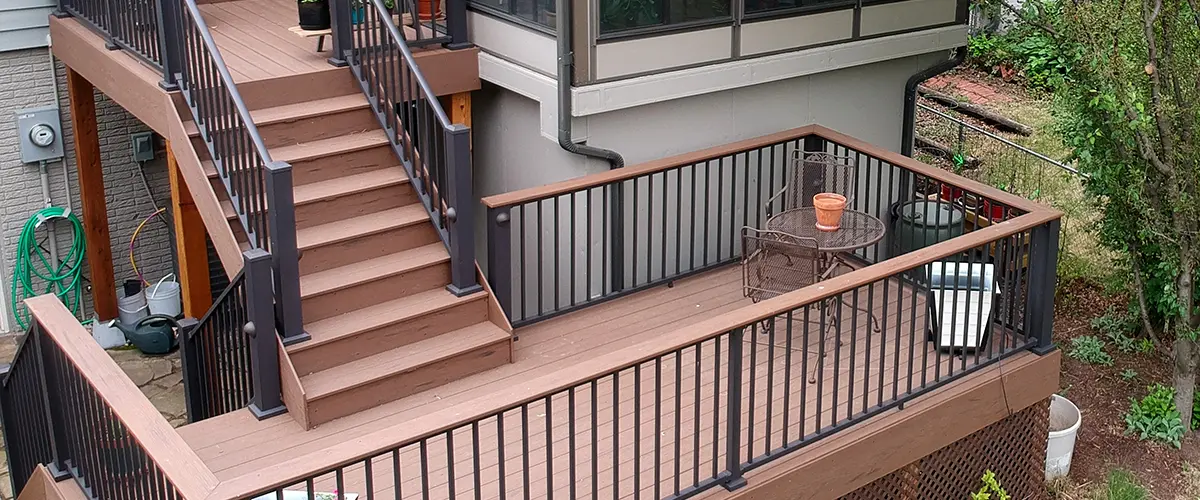 A set of two composite stairs with metal rails