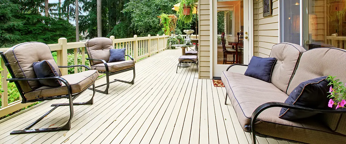 Beautiful beige decking with beige furniture and outdoor plants