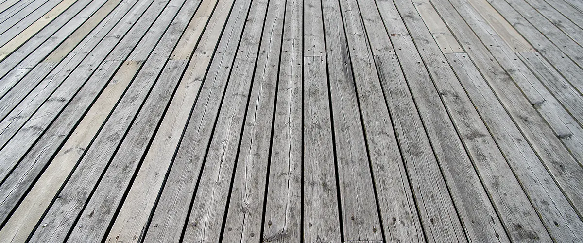 Cedar decking that remained untreated and dried in a gray color