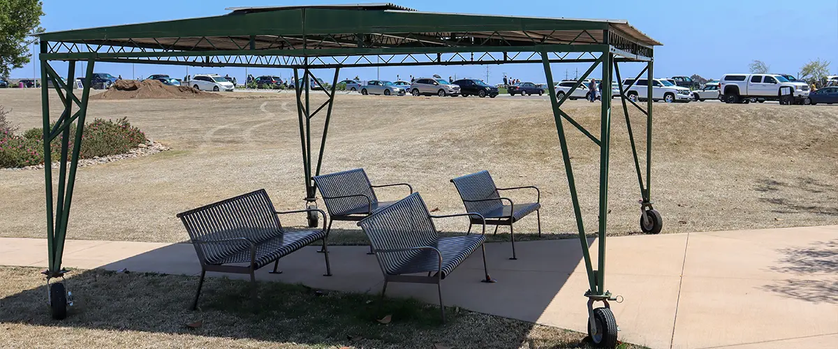 A metal portable awning or pergola made to move around