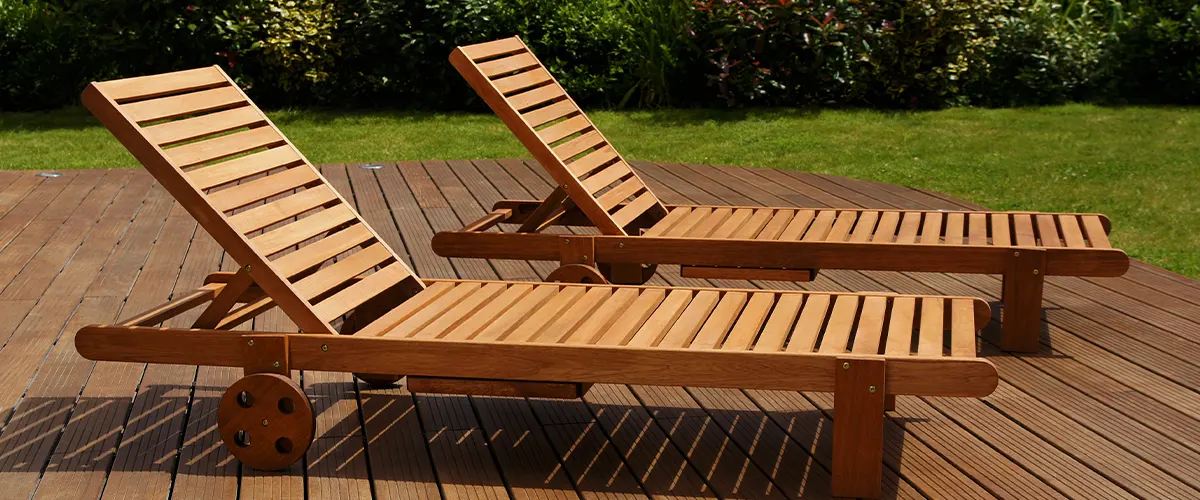 Two wood long chairs on a free standing deck