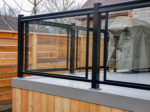 Metal railing with glass panels