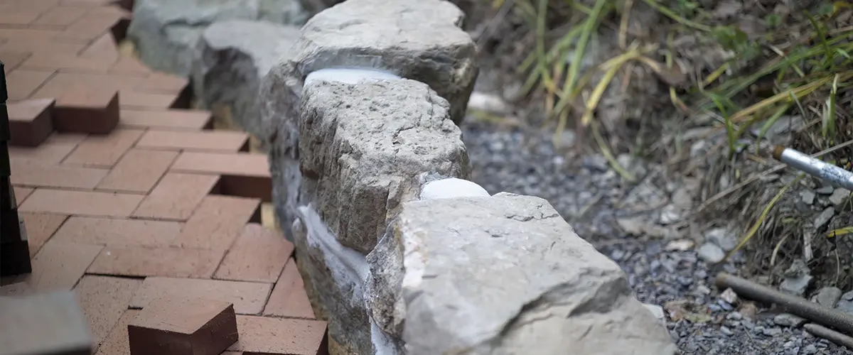Paver patio edge made of rocks