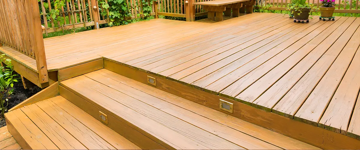 Wood fascia on an older deck with lights