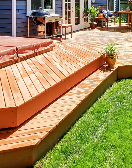 A wood fascia on ground level deck