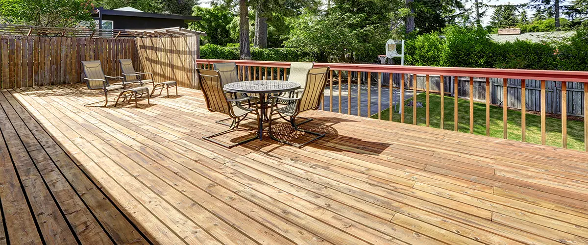 Wood deck with outdoor furniture and railings