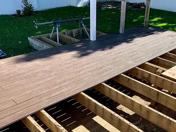 Composite decking with pressure treated frame