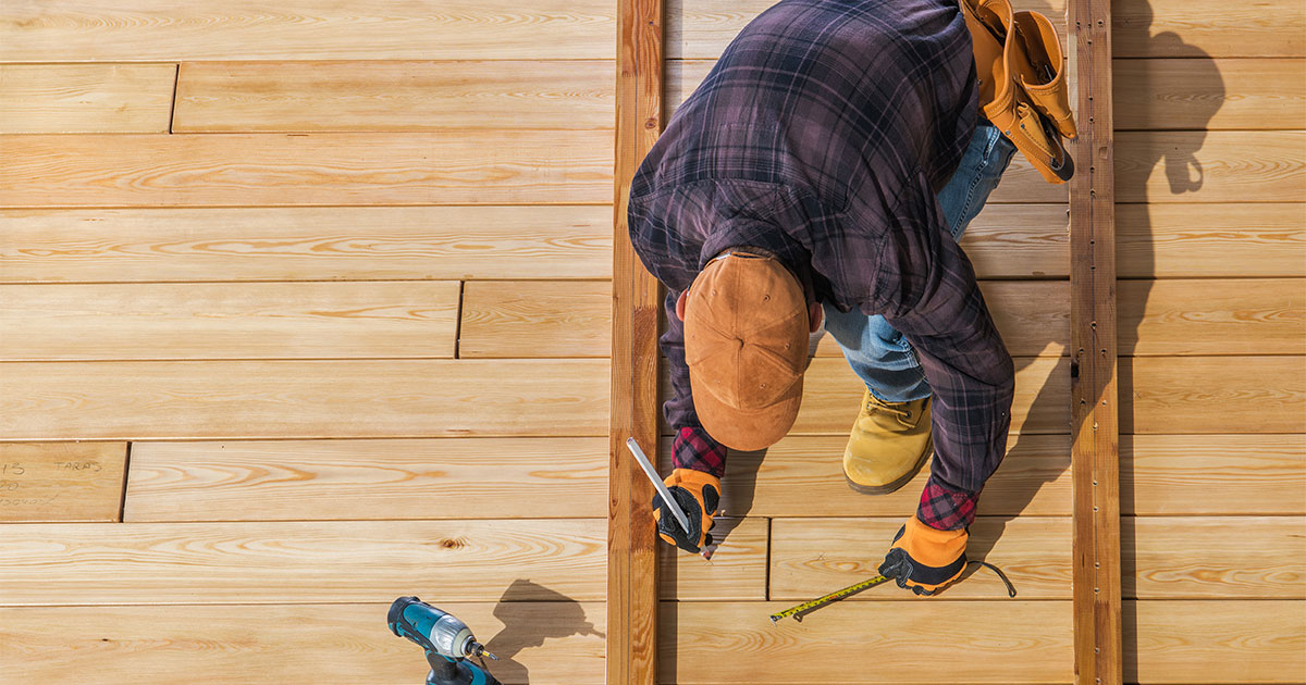 Contractor installing wood decking