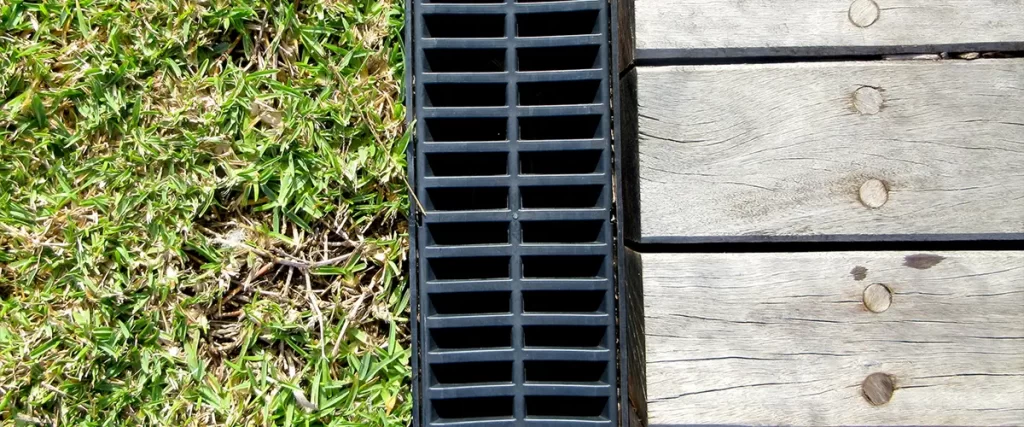 Omaha Deck Drainage Secrets: Guarding Against Heavy Midwestern Rains A deck drainage for a ground-level deck