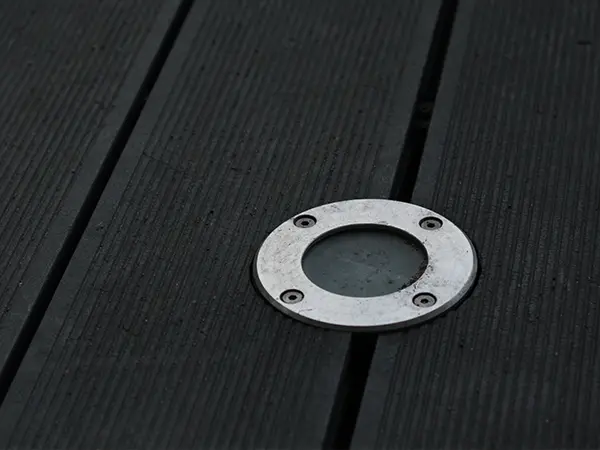 Deck lighting hardware installed on deck surface
