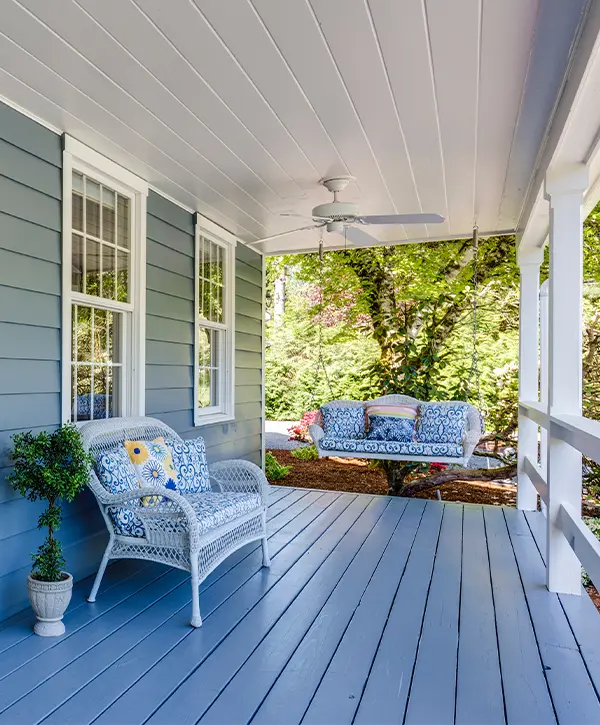 Wood decking on porch stained gray