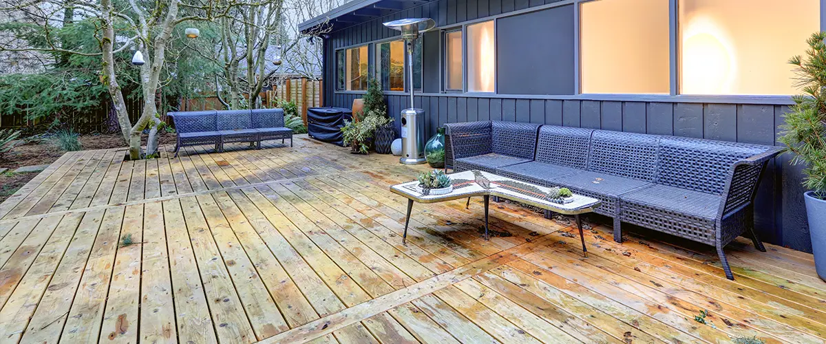 Wood decking with black outdoor furniture