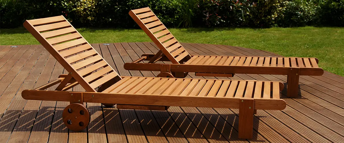 Two long wood chairs on composite decking