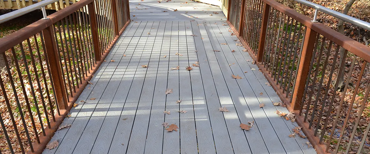 Composite decking with metal rusted railing