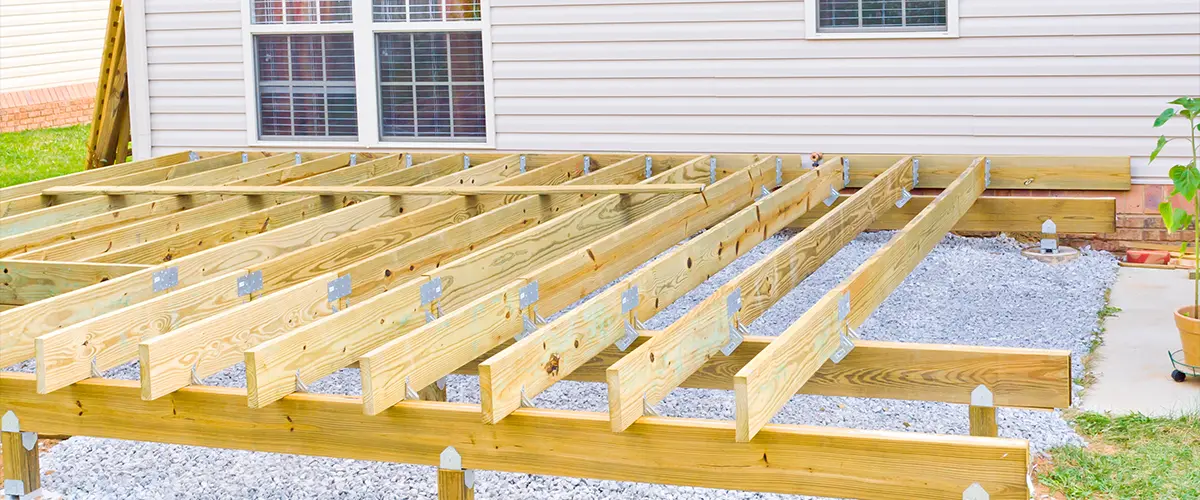 A deck construction frame made of pressure treated wood