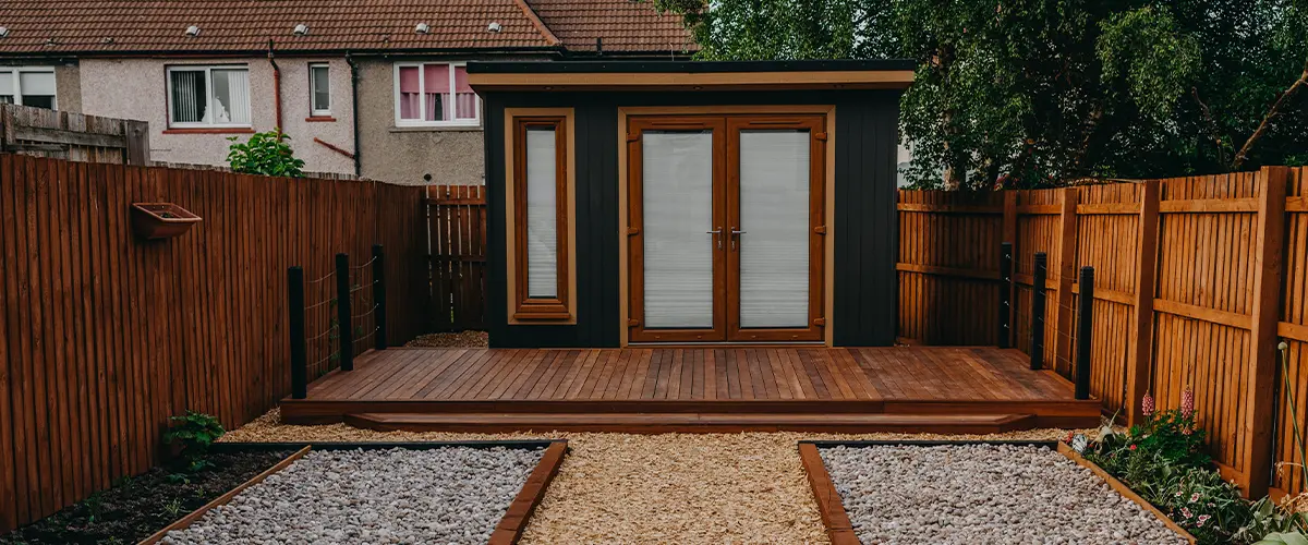 Hardwood decking with a shed in a backyard