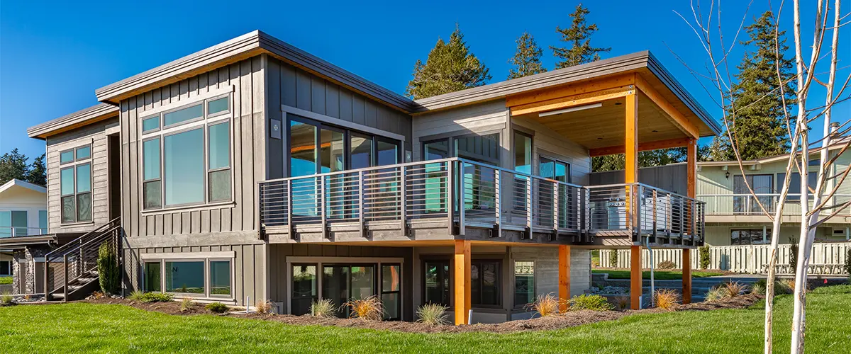 An upscale wood deck with metal railing built by one of the best deck building companies in Elkhorn