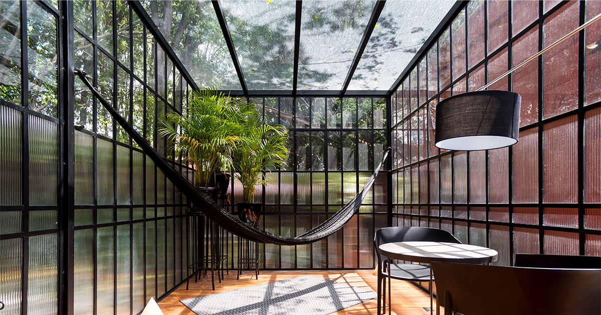 A solarium built with glass and black framing