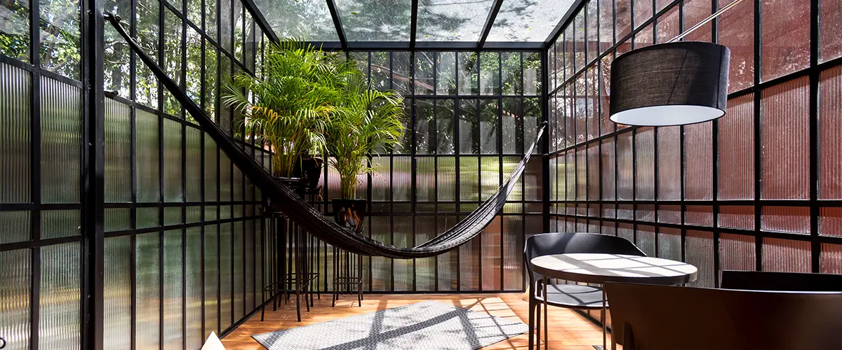 A solarium built with glass and black framing