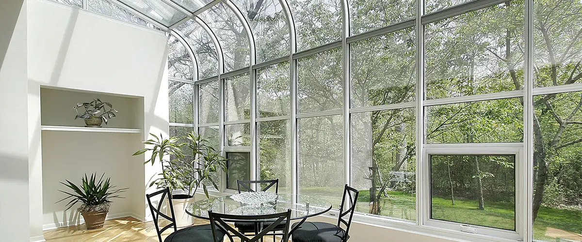 A solarium with white window framing