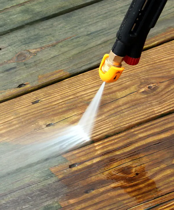 Pressure washing a decking surface