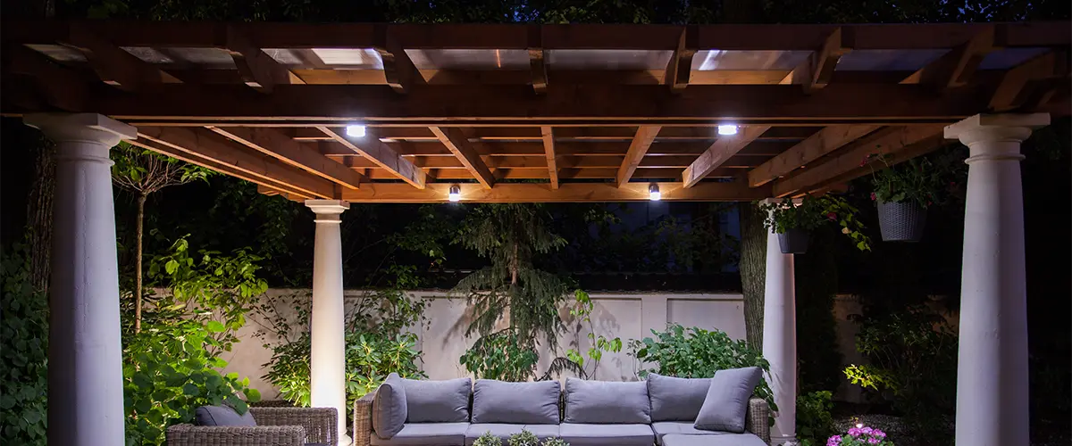 A pergola with a wood roof