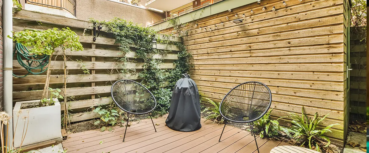 Wood decking with wood fence and plants