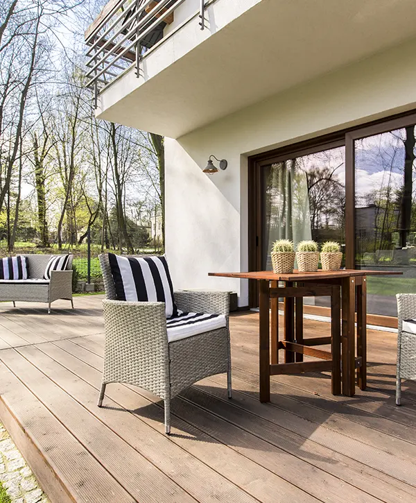 Composite decking with a small table and a chair