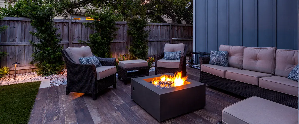 outdoor deck with firepit and seating area