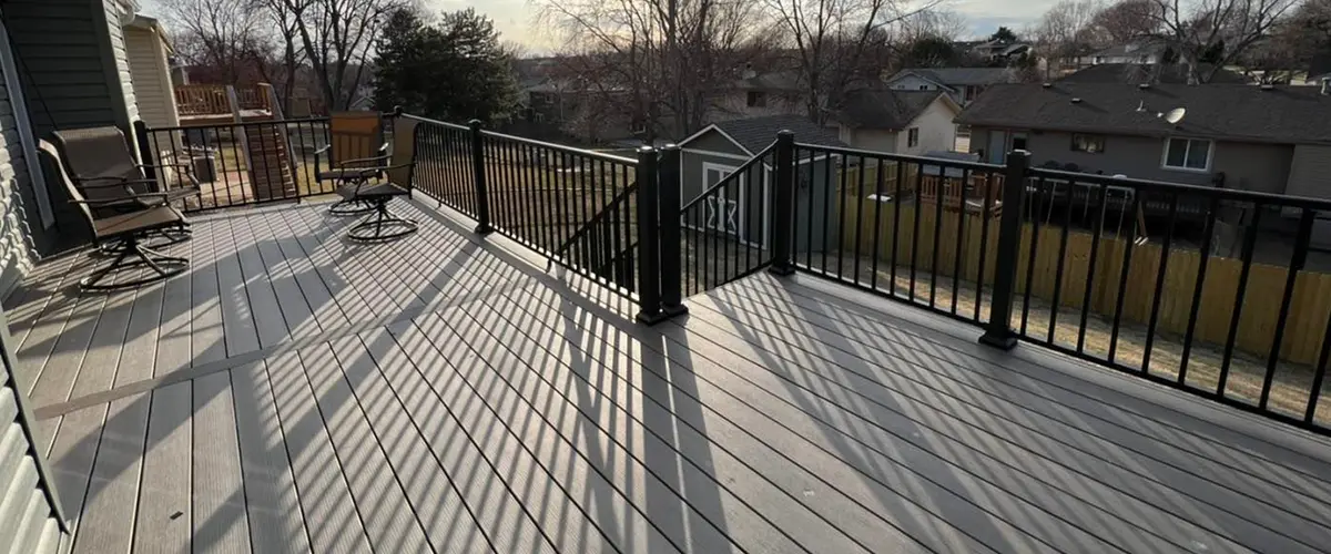 refinished deck with railings on a terrace