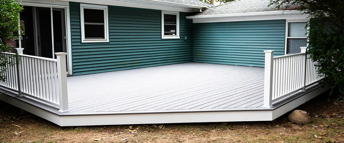 composite deck installation at the back of a house