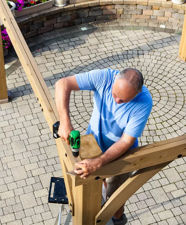 wooden pergola construction on a brick patio in Omaha