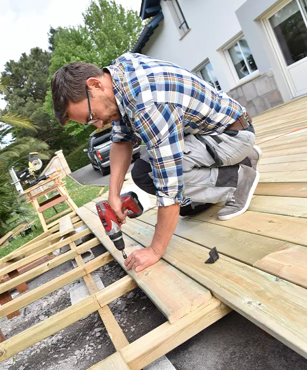 Carpenter building wooden deck, deck building