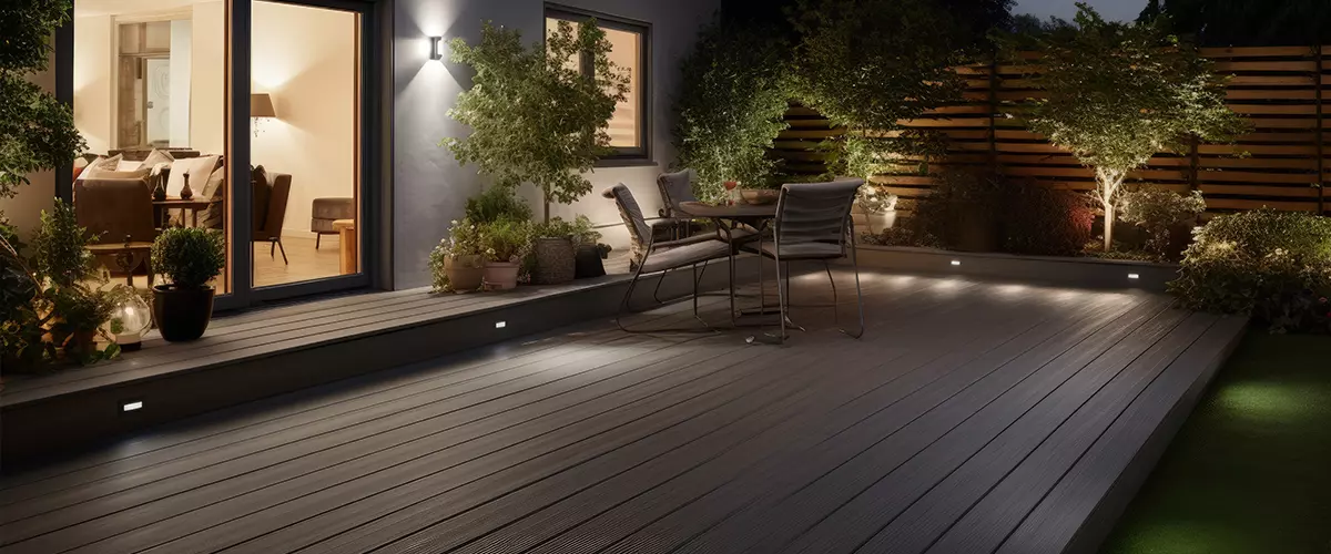 Composite decking in ash grey with two levels deck lights and ideal for a landscape gardener