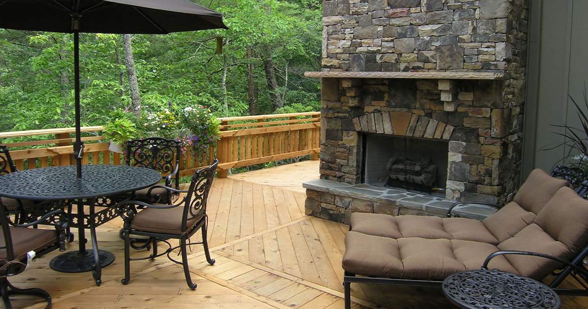 Deck Trends for 2024, luxury deck patio with table and chairs